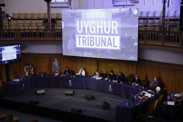 Members of the panel take their seats for the first day of hearings at the "Uyghur Tribunal," a panel of UK-based lawyers and rights experts investigating alleged abuses against Uyghurs in China, in London, on June 4, 2021. (Tolga Akmen/AFP via Getty Images)