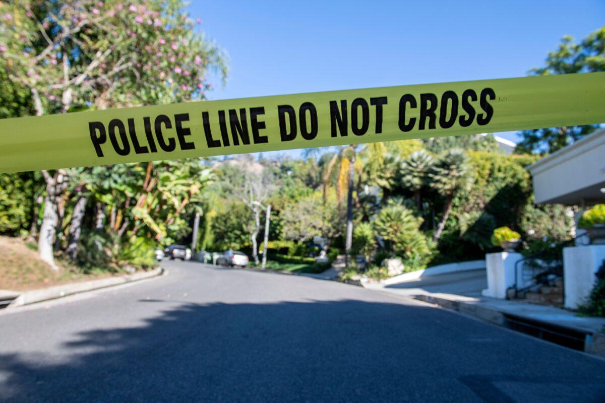 Yellow police tape blocks access to the scene where Jacqueline Avant was shot and killed by a burglar in Beverly Hills, Calif., on Dec. 1, 2021. (Valerie Macon/AFP via Getty Images)
