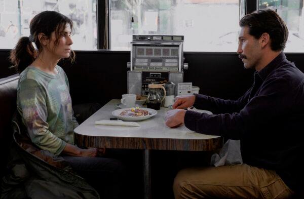 Ruth Slater (Sandra Bullock) sits in a diner with Blake (Jon Bernthal), in "The Unforgivable." (Kimberley French/Netflix)
