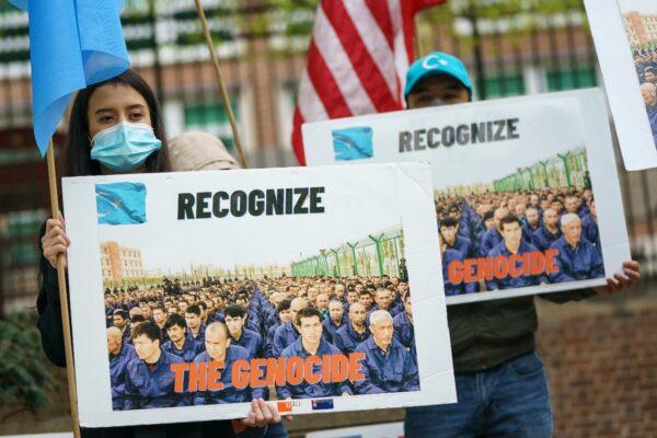 Supporters of the East Turkistan National Awakening Movement rally in front of the British Embassy on April 16, 2021 in Washington. The group is calling for Uyghurs and other Turkic people fleeing Xinjiang to be granted refugee status and calling for an international boycott of the 2022 Winter Olympic Games in Beijing, China. (Drew Angerer/Getty Images)