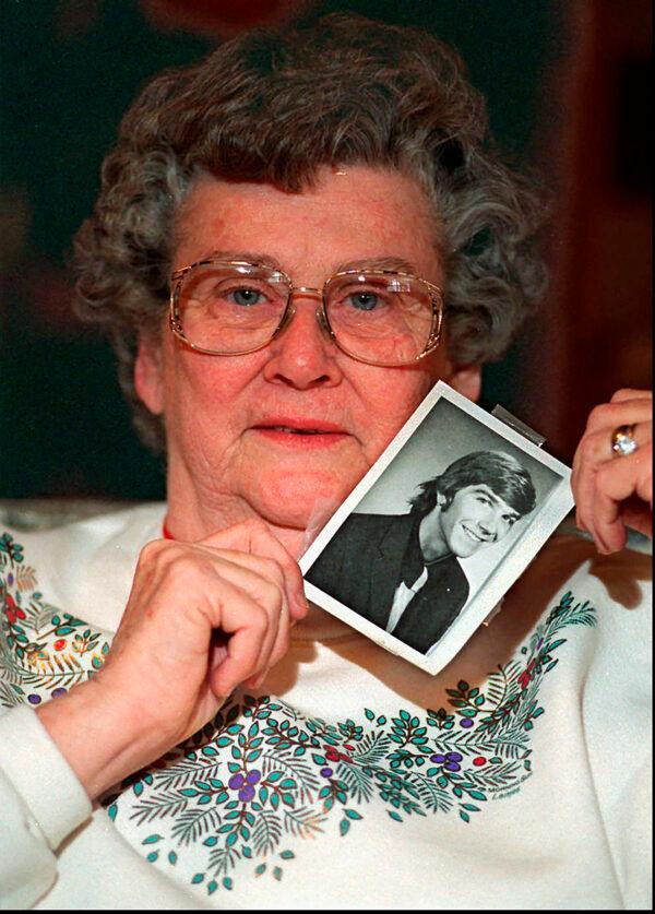 Louise Clinkscales holds a photo of her son Kyle Clinkscales at age 21 in a file photo. (Renee Hannis/Atlanta Journal-Constitution via AP)