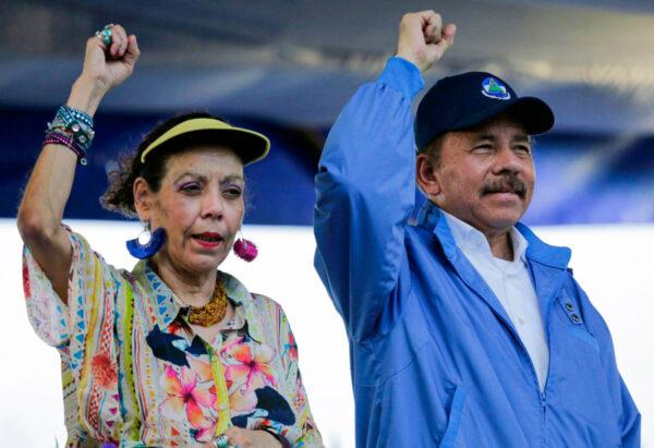 Nicaraguan President Daniel Ortega and his wife, Vice-President Rosario Murillo, raise their fists during the commemoration of the 51st anniversary of the Pancasan guerrilla campaign in Managua on Aug. 29, 2018. (Inti Ocon/AFP/Getty Images)