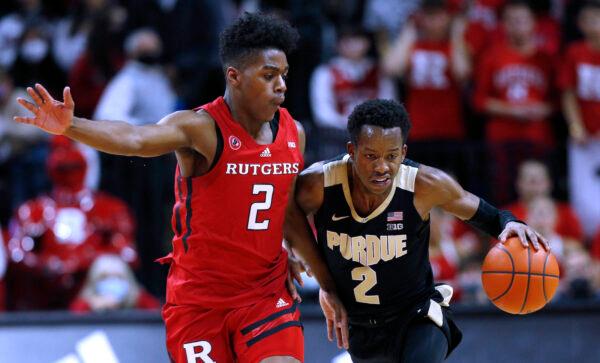 Purdue guard Eric Hunter Jr. (2) drives to the basket against Rutgers guard Jalen Miller (2) during the first half of an NCAA college basketball game in Piscataway, N.J., on Dec. 9, 2021. (Noah K. Murray/AP Photo)