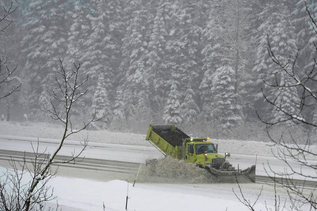 A Washington Dept. of Transportation snow plow works on a stretch of eastbound Interstate Highway 90, on Dec. 9, 2021. (Ted S. Warren/AP Photo)