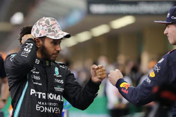 Mercedes driver Lewis Hamilton of Britain bumps fists with Red Bull driver Max Verstappen of the Netherlands after qualifying session for the Formula One Abu Dhabi Grand Prix in Abu Dhabi, United Arab Emirates, on Dec. 11, 2021. (Kamran Jebreili, Pool/AP Photo)