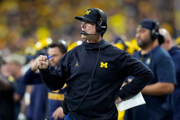 Michigan head coach Jim Harbaugh watches from the sideline during the first half of the Big Ten championship NCAA college football game against Iowa in Indianapolis, on Dec. 4, 2021. (AJ Mast/AP Photo)