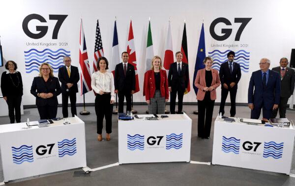 G-7 Foreign and Development Ministers pose for a group photo in Liverpool, England, on Dec. 12, 2021. (Olivier Douliery/Pool via AP)