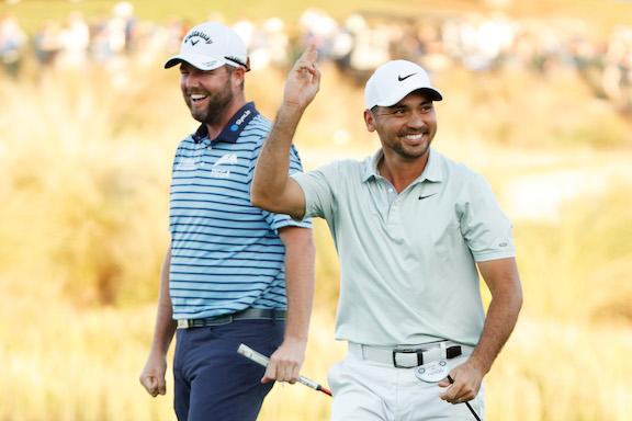 NAPLES, FLORIDA - DECEMBER 11: Marc Leishman of Australia and Jason Day of Australia celebrate their birdie on the 18th green during the second round of the QBE Shootout at Tiburon Golf Club in Naples, Florida, on December 10, 2021. (Cliff Hawkins/Getty Images)