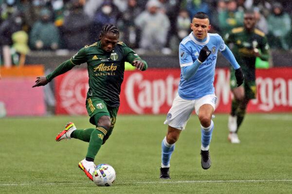 Portland Timbers midfielder Yimmi Chara (23) and New York City FC midfielder Alfredo Morales (7) race after the ball during the first half of the MLS Cup soccer match in Portland, Ore., on Dec. 11, 2021. (Amanda Loman/AP Photo)