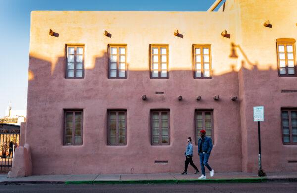 People walk together in downtown Santa Fe, N.M., on Dec. 4, 2021. (John Fredricks/The Epoch Times)