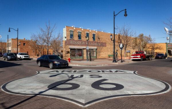 A marking for U.S. Route 66 labels an intersection in Winslow, Ariz., on Dec. 5, 2021. (John Fredricks/The Epoch Times)