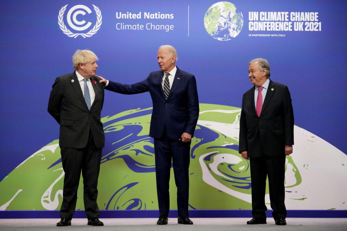UK Prime Minister Boris Johnson (L) and U.N. Secretary-General Antonio Guterres (R) greet U.S. President Joe Biden at COP26 in Glasgow, Scotland, on Nov. 1, 2021. (Christopher Furlong/Getty Images)