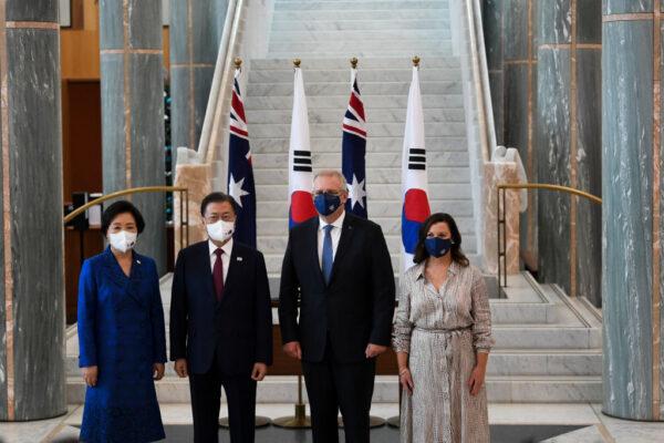 Australian Prime Minister Scott Morrison (2nd R) with First Lady Jenny Morrison (R) pose for photographs with South Korean President Moon Jae-in (2nd L) and First Lady Kim Jung-sook (L) at Parliament House on December 13, 2021, in Canberra, Australia. (Lukas Coch - Pool/Getty Images)