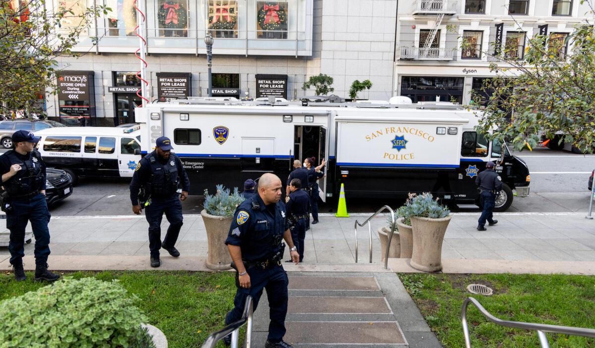 Police patrol Union Square in San Francisco on Nov. 30, 2021. Stores have increased security in response to a spike in thefts. (Ethan Swope/Getty Images)