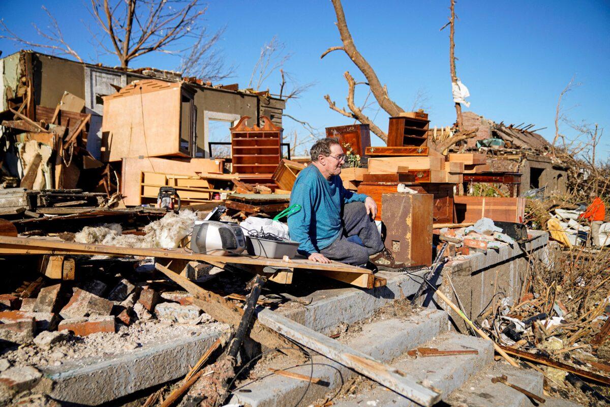 Rick Foley, 70, sits outside his home after a devastating outbreak of tornadoes ripped through several U.S. states in Mayfield, Ky., on Dec. 11, 2021. (Cheney Orr/Reuters)