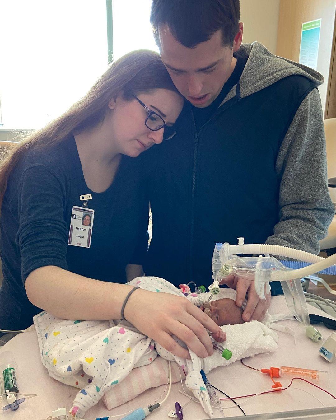 Hannah and her husband, Jake, with their late baby daughter Meredith, who passed away three days after birth. (Courtesy of <a href="https://www.instagram.com/quintupletmama/">Hannah Merton</a>)