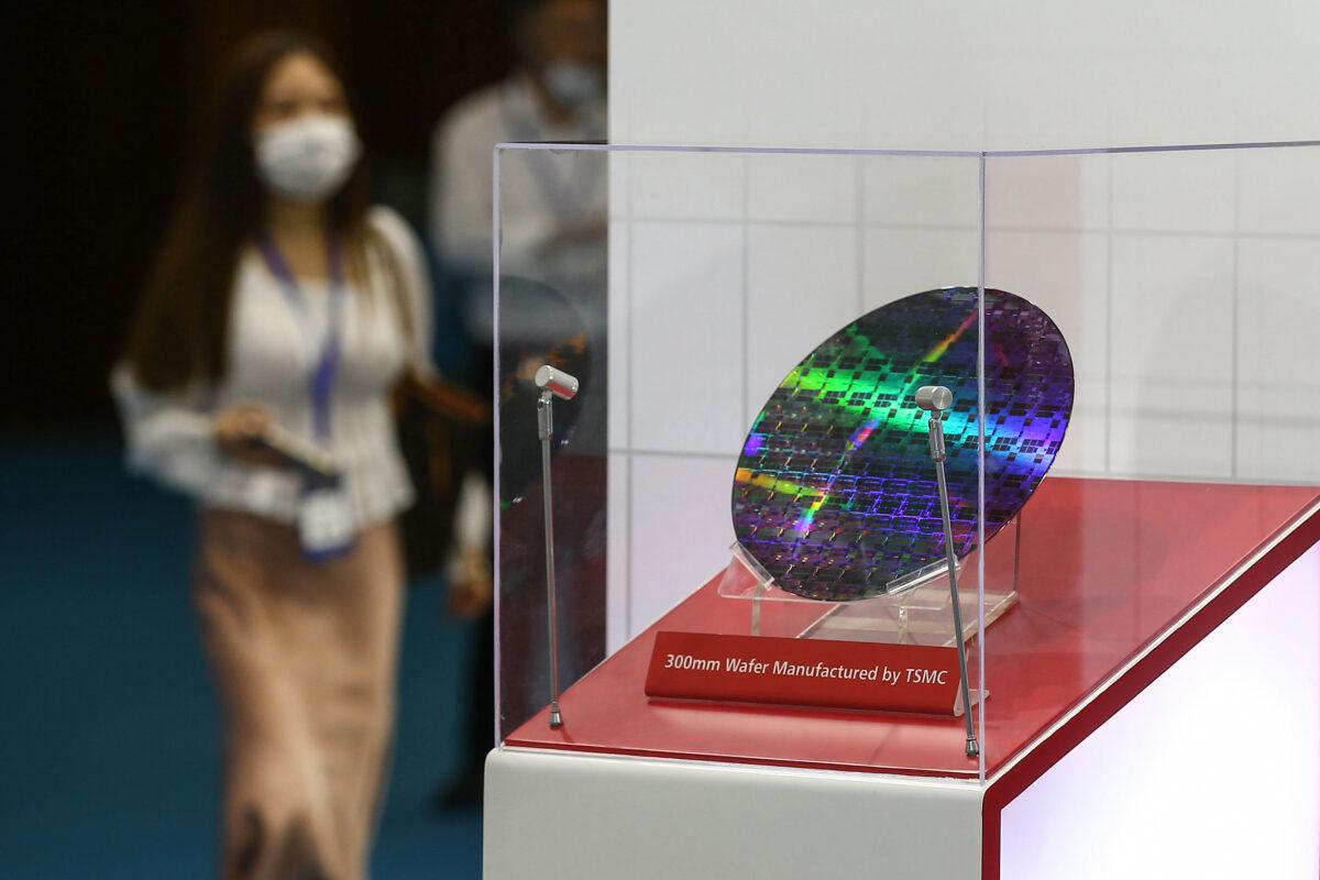 A chip by Taiwan Semiconductor Manufacturing Company (TSMC) is seen at the 2020 World Semiconductor Conference. (STR / AFP)