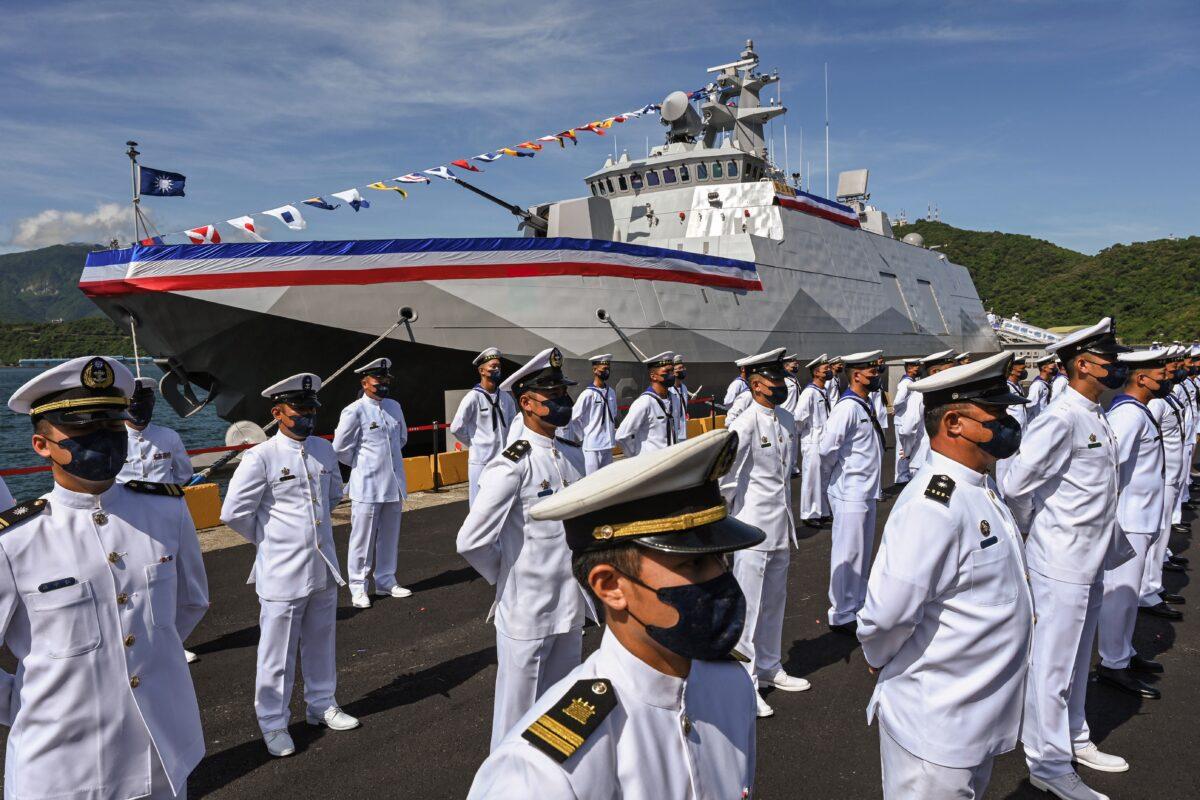 Taiwanese naval personnel stand in front of a Ta Chiang Corvette during an inauguration ceremony in Yilan, Taiwan, on Sept. 9, 2021. (Sam Yeh/AFP via Getty Images)