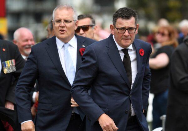 Australia's Prime Minister Scott Morrison (L) and Victoria State Premier Daniel Andrews (R) depart after attending a Remembrance Day service at the Shrine of Remembrance in Melbourne, Australia, on Nov. 11, 2021. (William West/AFP via Getty Images)