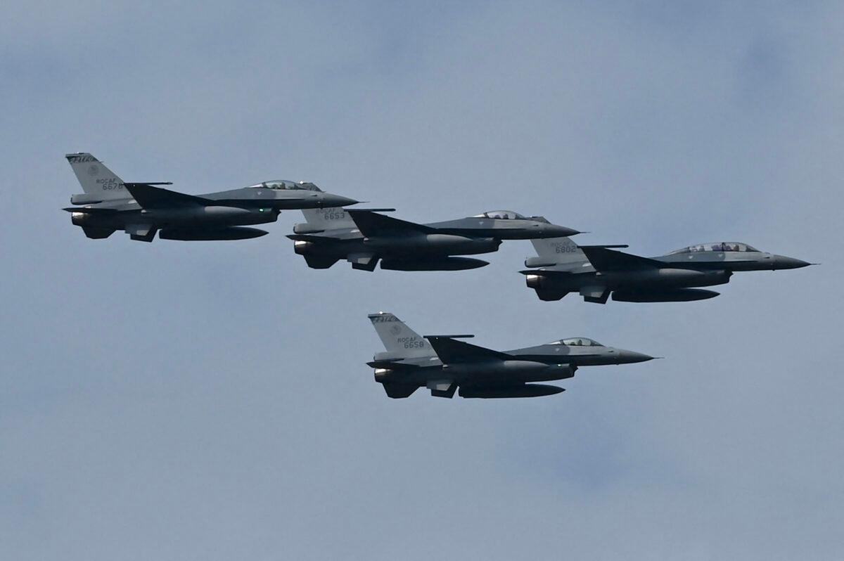 Four upgraded U.S.-made F-16 V fighters fly during a demonstration at a ceremony at the Chiayi Air Force in southern Taiwan on Nov. 18, 2021. (Sam Yeh/AFP via Getty Images)