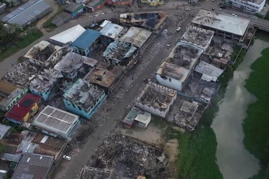 An aerial view shows burnt-out buildings in Honiara’s Chinatown in the Solomon Islands on Nov. 27, 2021 (Jay Liofasi/AFP via Getty Images)