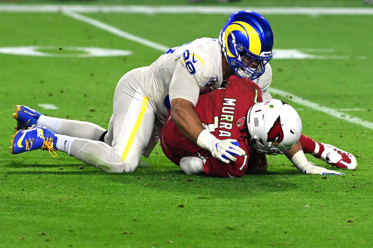Kyler Murray #1 of the Arizona Cardinals is sacked by Aaron Donald #99 of the Los Angeles Rams in the second quarter of the game at State Farm Stadium in Glendale, Ariz., on Dec. 13, 2021. (Norm Hall/Getty Images)