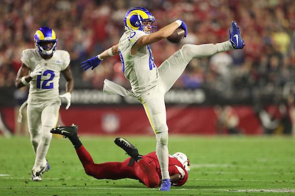 Cooper Kupp #10 of the Los Angeles Rams carries the ball after a reception during the fourth quarter against the Arizona Cardinals at State Farm Stadium in Glendale, Ariz., on Dec. 13, 2021. (Christian Petersen/Getty Images)