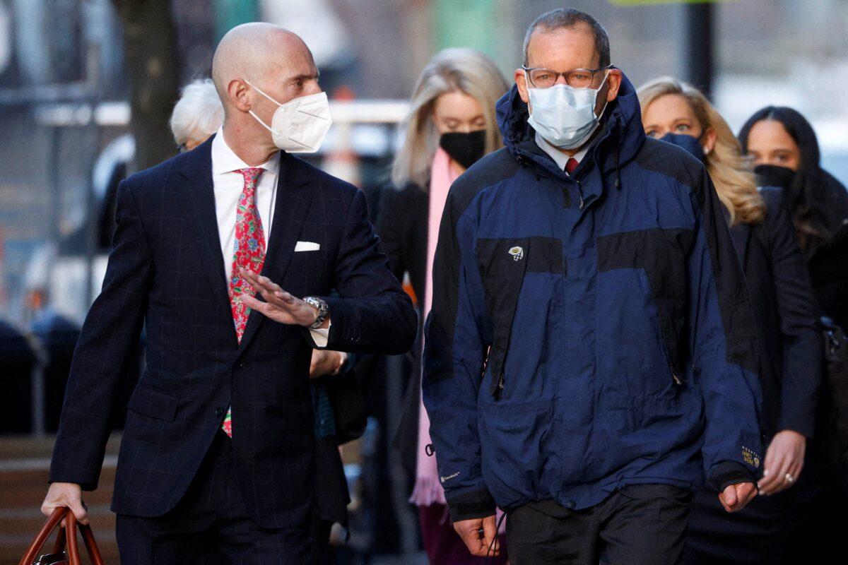 Harvard University nanotechnology professor Charles Lieber (R) arrives at the federal courthouse in Boston on Dec. 14, 2021. (Brian Snyder/Reuters)
