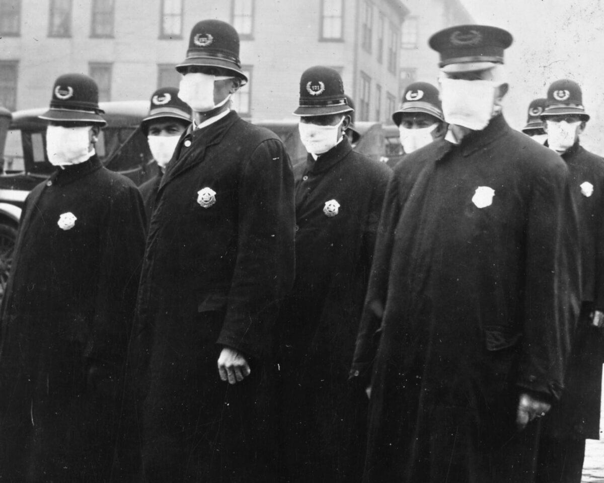  Seattle policemen wear white cloth face masks during the Spanish flu pandemic, in December 1918. (Public Domain)