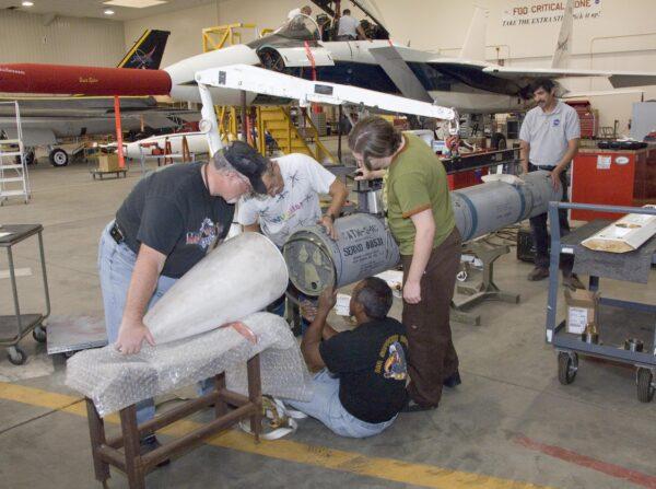 NASA Dryden aircraft and avionics technicians install the nose cone on a hypersonic Phoenix missile prior to a fit check on the center's F-15B research aircraft in Washington on Nov. 13, 2006. (NASA Photo / Tom Tschida)