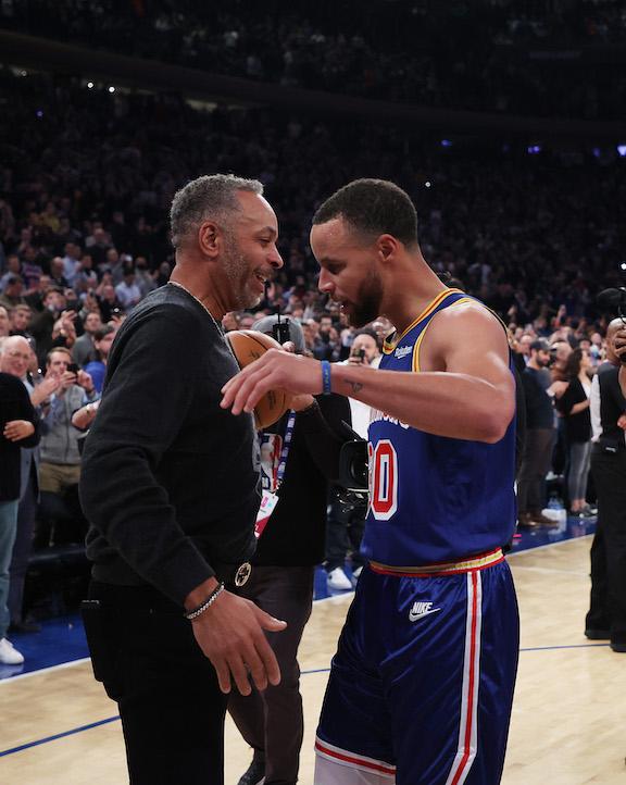 Stephen Curry #30 of the Golden State Warriors hugs his Dad Dell Curry after making a three-point basket to break Ray Allen’s record for the most all-time against the New York Knicks during their game at Madison Square Garden in New York City, on Dec. 14, 2021. (Al Bello/Getty Images)