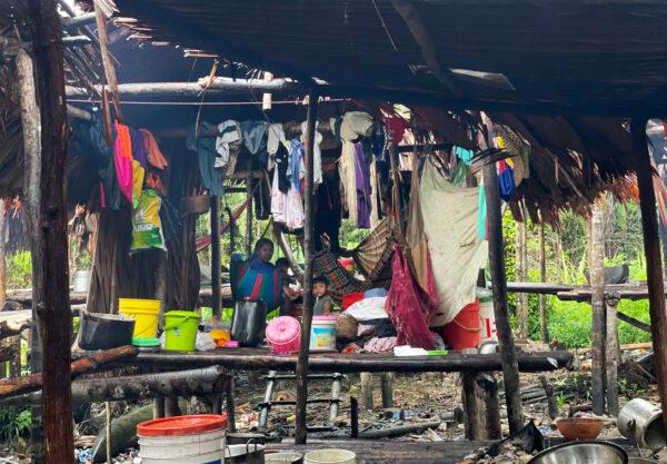 Basic living conditions of refugees in Guyana on Nov. 20, 2021. Their basic necessities are limited to clothing, buckets, pots, and the hammocks they sleep in. (Richard Bhainie/The Epoch Times)