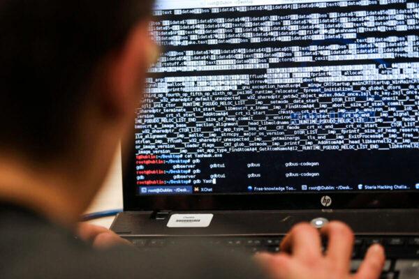 An engineering student takes part in a hacking challenge near Paris on March 16, 2013. (AFP via Getty Images/Thomas Samson)