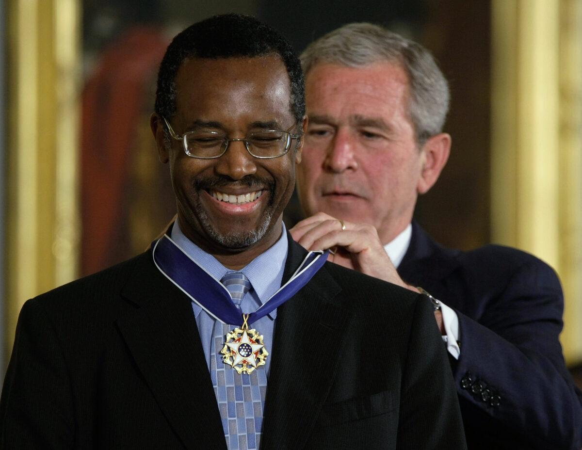 U.S. President George W. Bush, right, presents a Presidential Medal of Freedom to Dr. Ben Carson for his work with neurological disorders during an East Room ceremony at the White House in Washington on June 19, 2008. (Alex Wong/Getty Images)