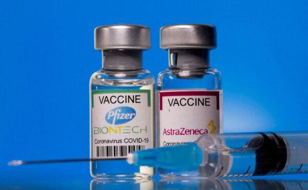 Vials with Pfizer-BioNTech and AstraZeneca COVID-19 vaccine labels are seen in this illustration picture taken on March 19, 2021. (Dado Ruvic/Reuters)