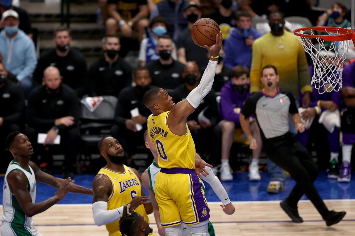 Russell Westbrook #0 of the Los Angeles Lakers drives to the basket against the Dallas Mavericks in the first half at American Airlines Center in Dallas, on Dec. 15, 2021. (Tom Pennington/Getty Images)