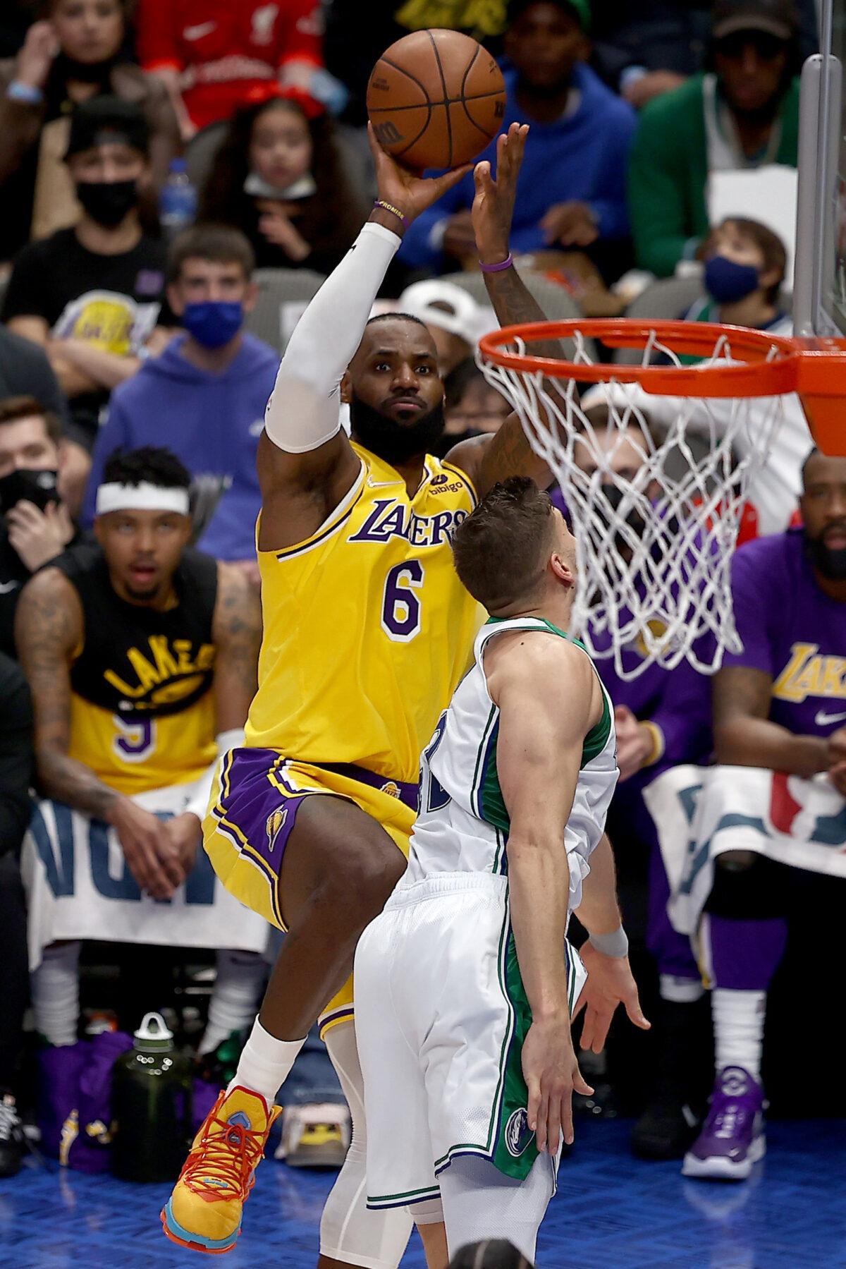 LeBron James #6 of the Los Angeles Lakers shoots the ball against Maxi Kleber #42 of the Dallas Mavericks in the first half at American Airlines Center in Dallas, on Dec. 15, 2021. (Tom Pennington/Getty Images)