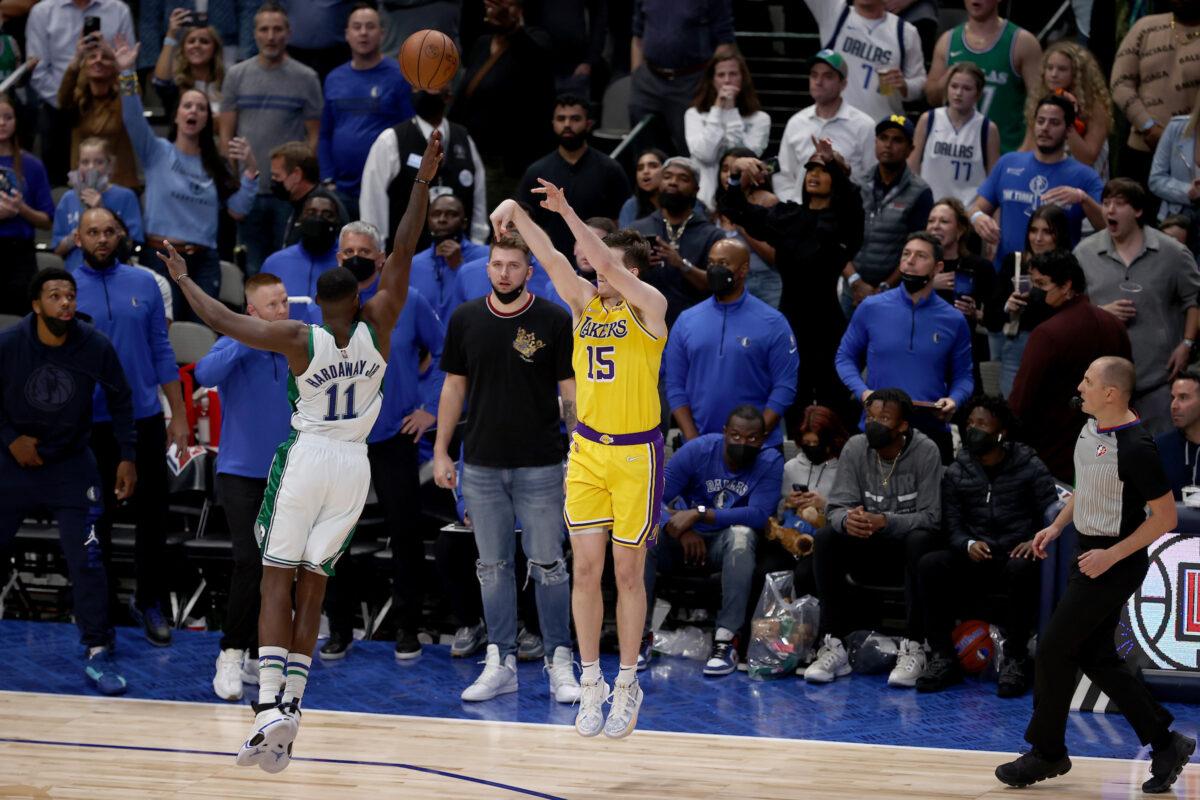 Austin Reaves #15 of the Los Angeles Lakers shoots the game-winning shot against Tim Hardaway Jr. #11 of the Dallas Mavericks in overtime at American Airlines Center in Dallas, on Dec. 15, 2021. (Tom Pennington/Getty Images)