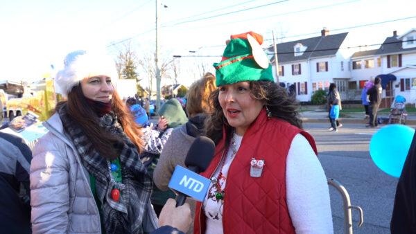 Jacqueline Hopkins, an office manager for a law firm, expresses her happiness at the Christmas parade, in Elsmere, Del., on Dec. 12, 2021. (Screenshot via NTD)