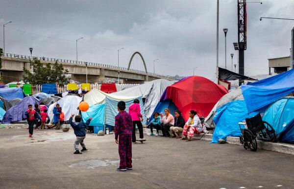 Central and South American migrants await access into the United States at the El Chapperal migrant encampment in Tijuana, Mexico, on May 22, 2021. (John Fredricks/The Epoch Times)