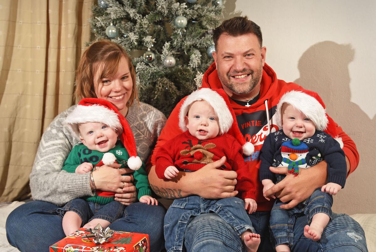 The triplets, Colby, Odyn, and Rico, with mum, Megan Smyth, 32, and their dad, Clayton, 42. (Courtesy of Caters News)