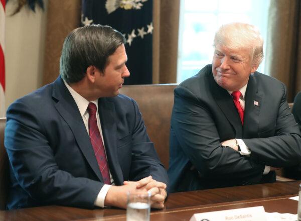 Florida Governor-elect Ron DeSantis (R) sits next to President Donald Trump during a meeting with Governors-elect in the Cabinet Room at the White House on Dec. 13, 2018. (Mark Wilson/Getty Images)