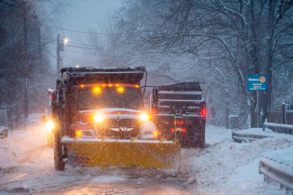 A convoy of snowplows works to clear the roads in the early morning during Winter Storm Ezekiel in Wakefield, Mass., on Dec. 3, 2019. (Joseph Prezioso/AFP)