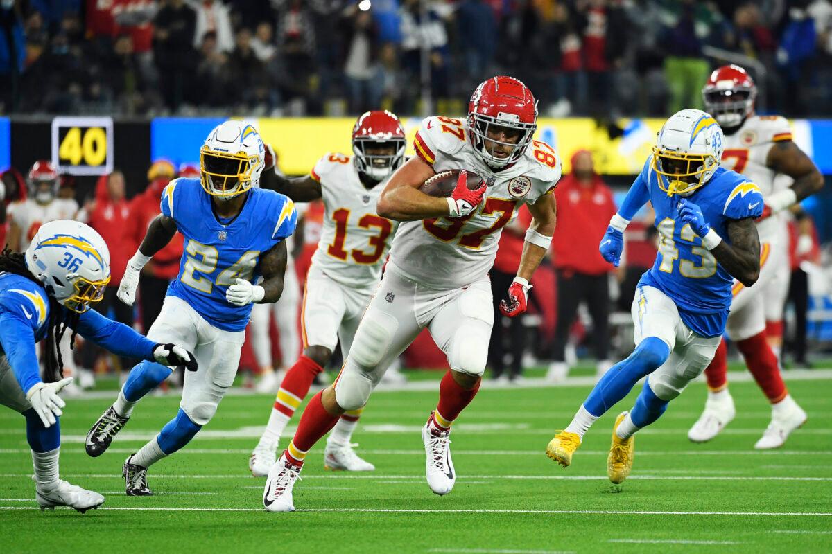Travis Kelce #87 of the Kansas City Chiefs carries the ball for a touchdown during overtime against the Los Angeles Chargers at SoFi Stadium in Inglewood, Calif., on Dec. 16, 2021. (Kevork Djansezian/Getty Images)