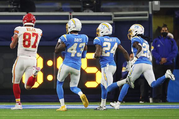 Travis Kelce #87 of the Kansas City Chiefs carries the ball for a touchdown during overtime against the Los Angeles Chargers at SoFi Stadium in Inglewood, Calif., on Dec. 16, 2021. (Harry How/Getty Images)