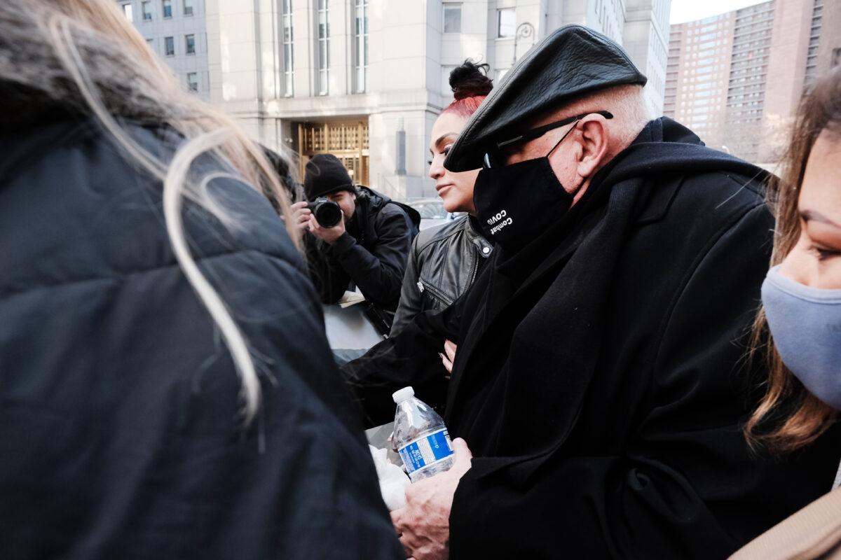 Juan Alessi, the former house manager of Jeffrey Epstein's Palm Beach estate, is led quickly to a car after testifying in court at the trial of Ghislaine Maxwell for child sex trafficking on Dec. 03, 2021 in New York City. (Spencer Platt/Getty Images)