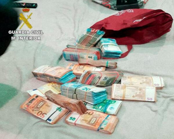 Money seized during the raid to arrest internationally wanted drug trafficker Fikri Amellah and 16 people from his network in Barcelona, Spain, on Dec. 17, 2021. (Guardia Civil-Ministerio del Interior/Handout via Reuters)