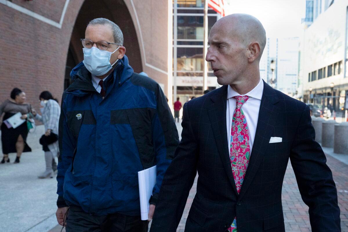 Harvard University professor Charles Lieber (L) leaves federal court with his attorney, Marc Mukasey, in Boston, Mass., on Dec. 14, 2021. (AP Photo/Michael Dwyer)