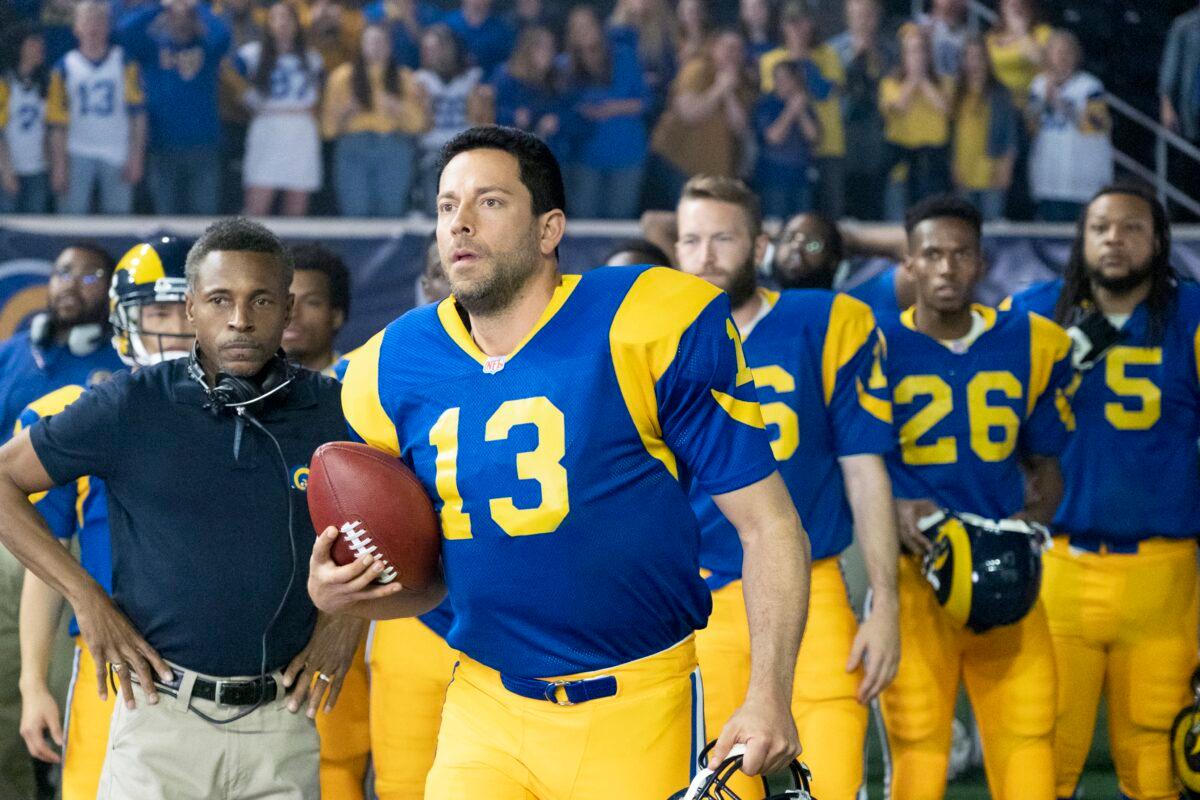 Kurt Warner (Zachary Levi, C) is a newly minted Rams quarterback, in "American Underdog." (Lionsgate)