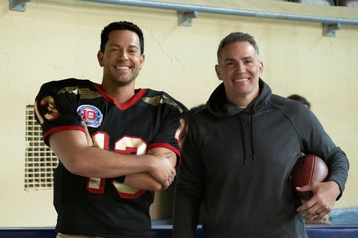 Zachary Levi (L) and the real Kurt Warner pose for the cameras on the set of "American Underdog." (Lionsgate)